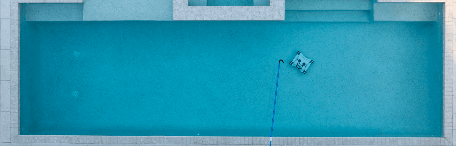 Water Tech robotic pool cleaner sweeping the bottom of a pool